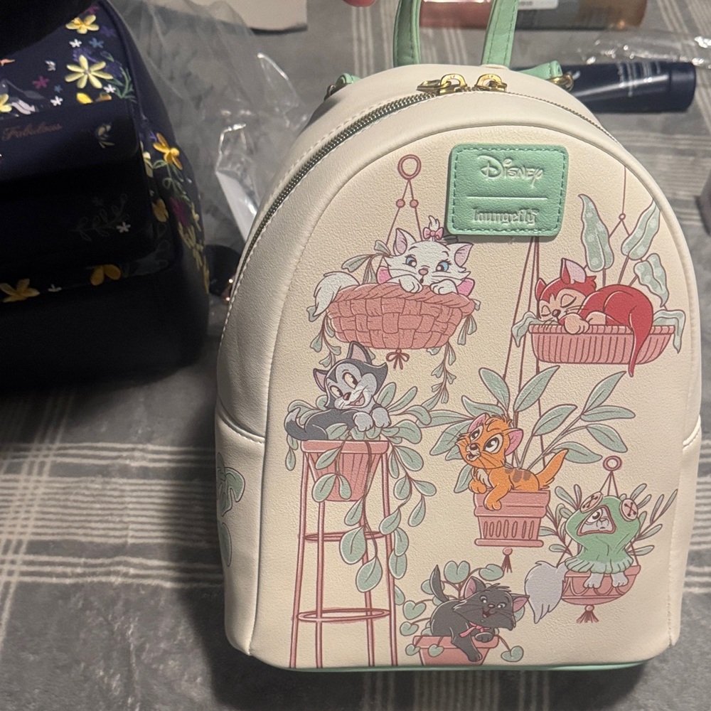 Loungefly Cream Backpack with Playful Pet Design